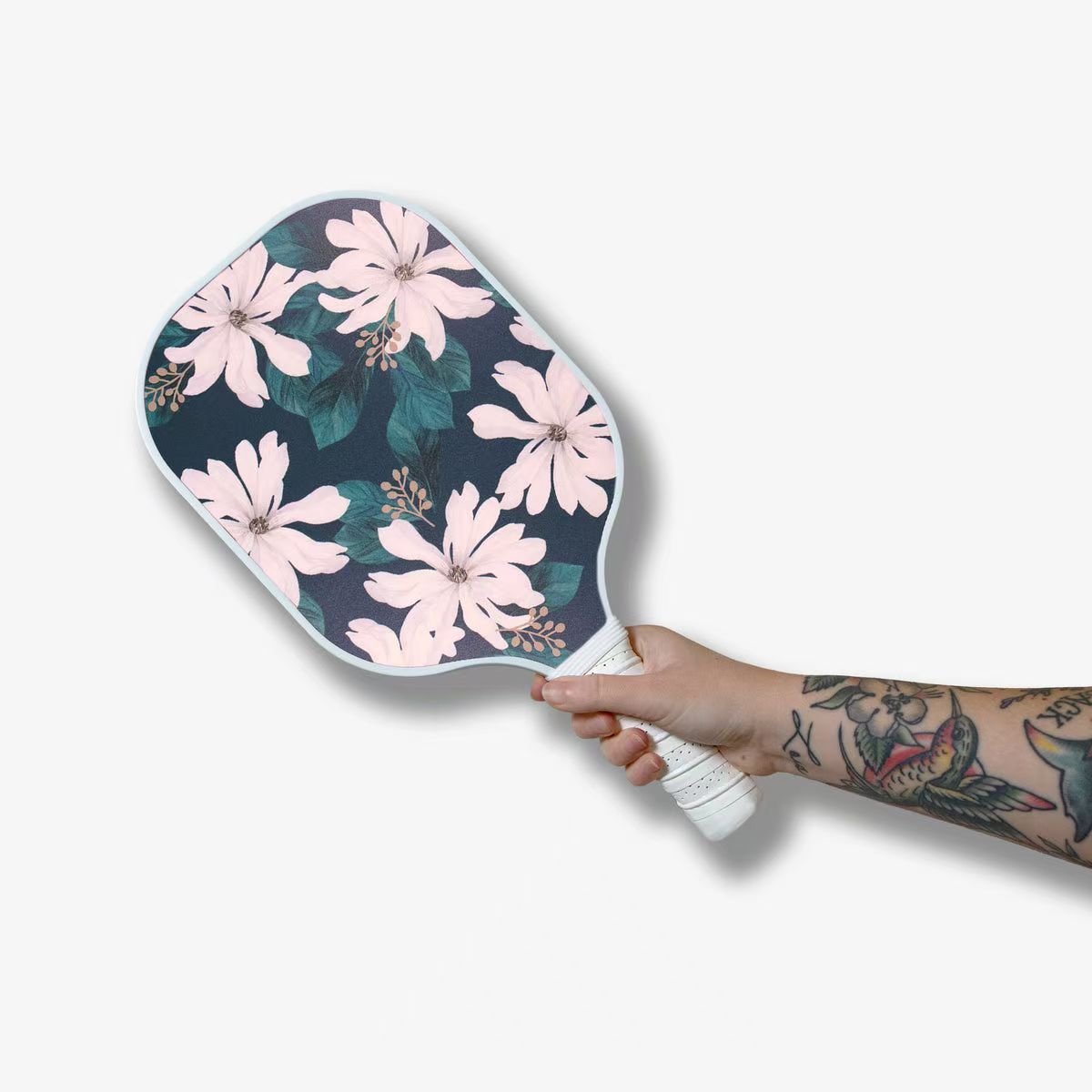 Floral custom pickleball paddle held in hand